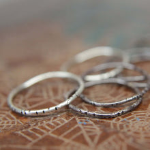 Load image into Gallery viewer, Textured wobble rings set.                                   Seven sterling silver organic stacking rings. Hand textured stacking rings set.
