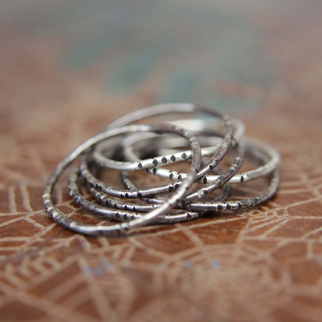 Textured wobble rings set.                                   Seven sterling silver organic stacking rings. Hand textured stacking rings set.
